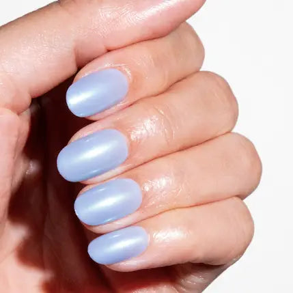 Hand with light blue nail polish on a white background