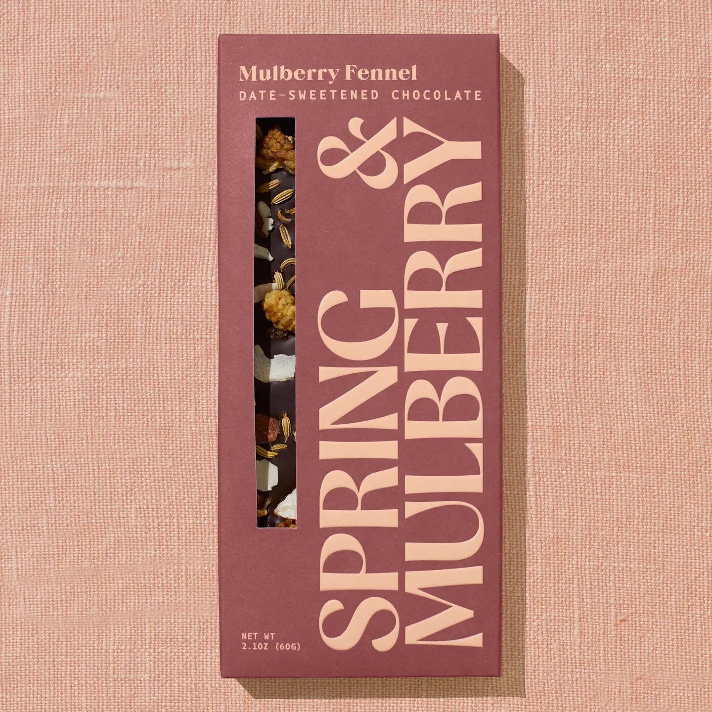 Spring & Mulberry chocolate packaging on a beige background
