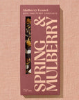 Spring & Mulberry chocolate packaging on a beige background