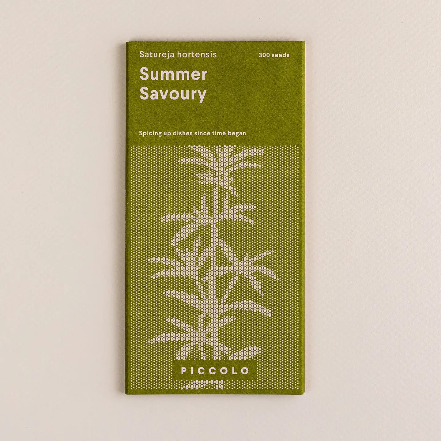 Green packet of Summer Savoury seeds with plant illustration on a beige background