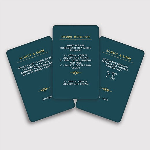 teal colored cards with gold text with trivia questions 