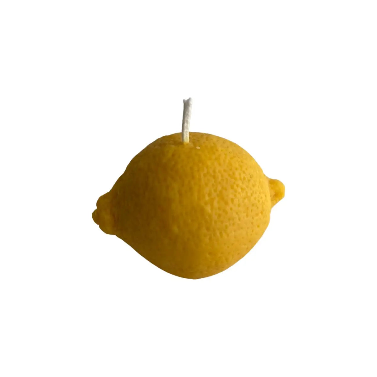 Yellow lemon-shaped candle on a white background