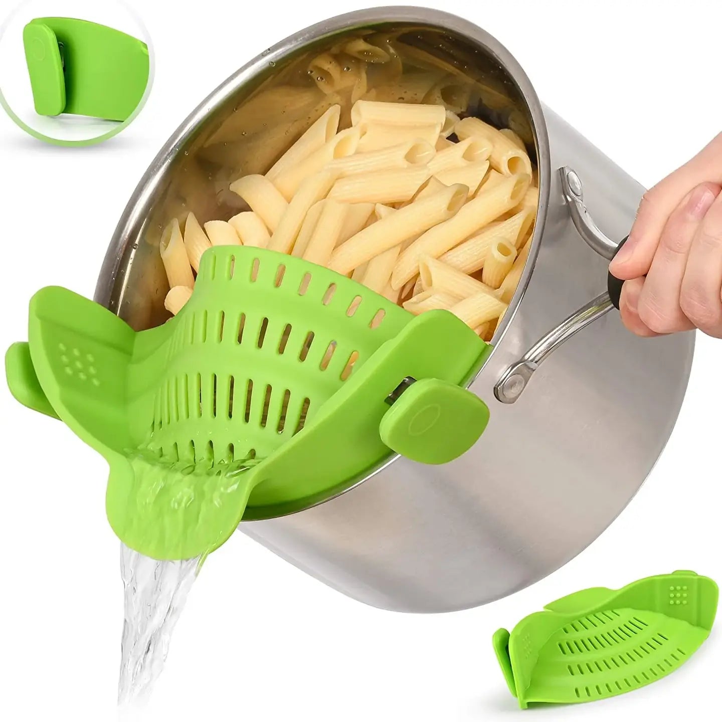 Green kitchen tool being used to drain pasta from a pot