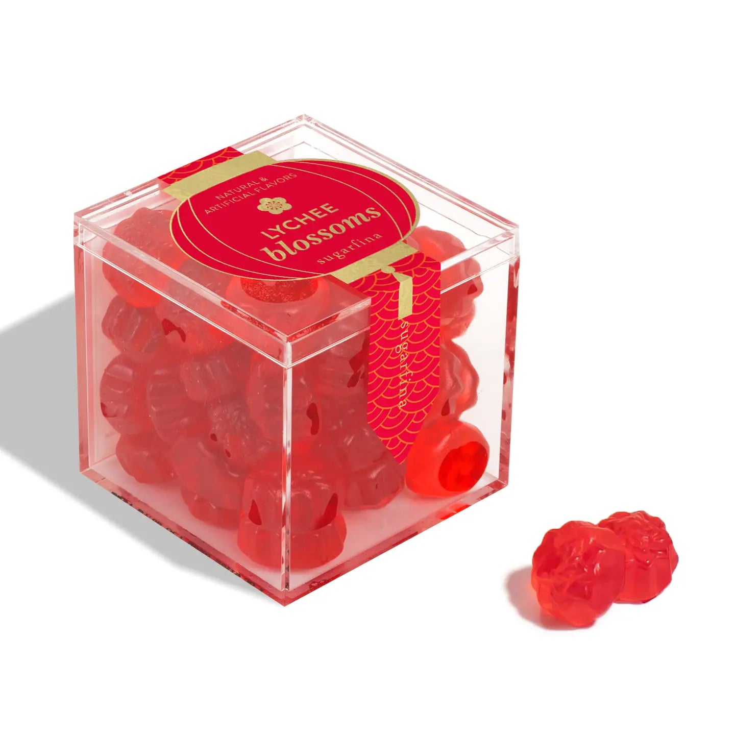 Red gummy bears in a clear cube container with 'L'chay blossoms' branding on a white background.