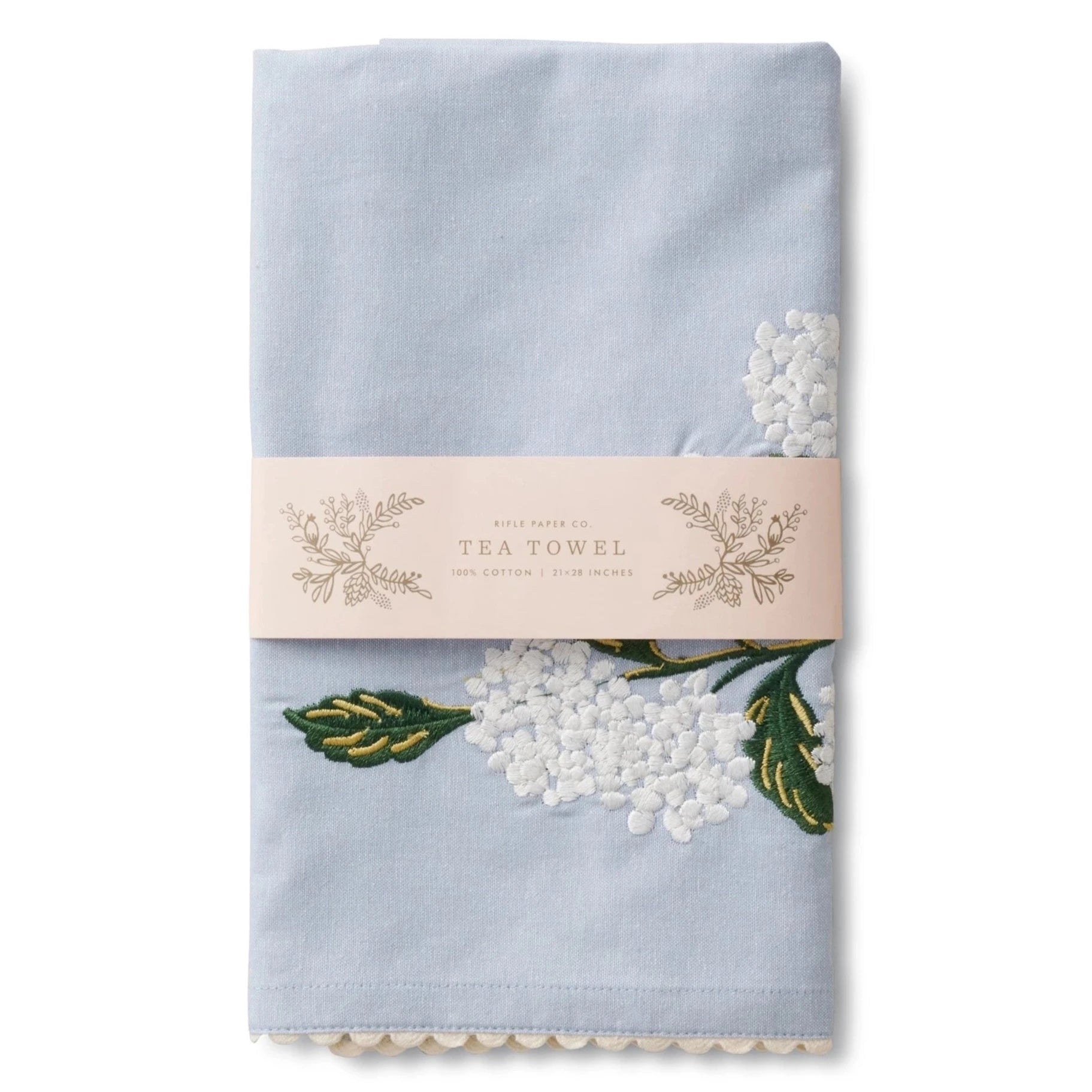blue tea towel with white hydrangea embroidered on it
