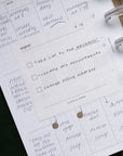 Planner with handwritten tasks and appointments