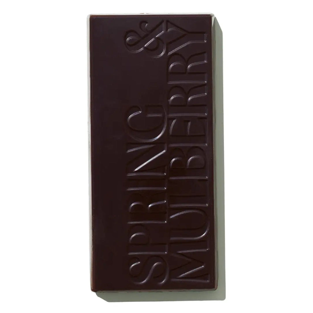 Dark chocolate bar with 'Spring & Mulberry' branding on a white background