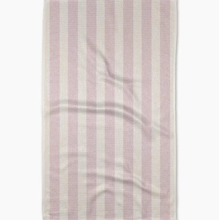 Striped fabric with pink and white pattern on a white background
