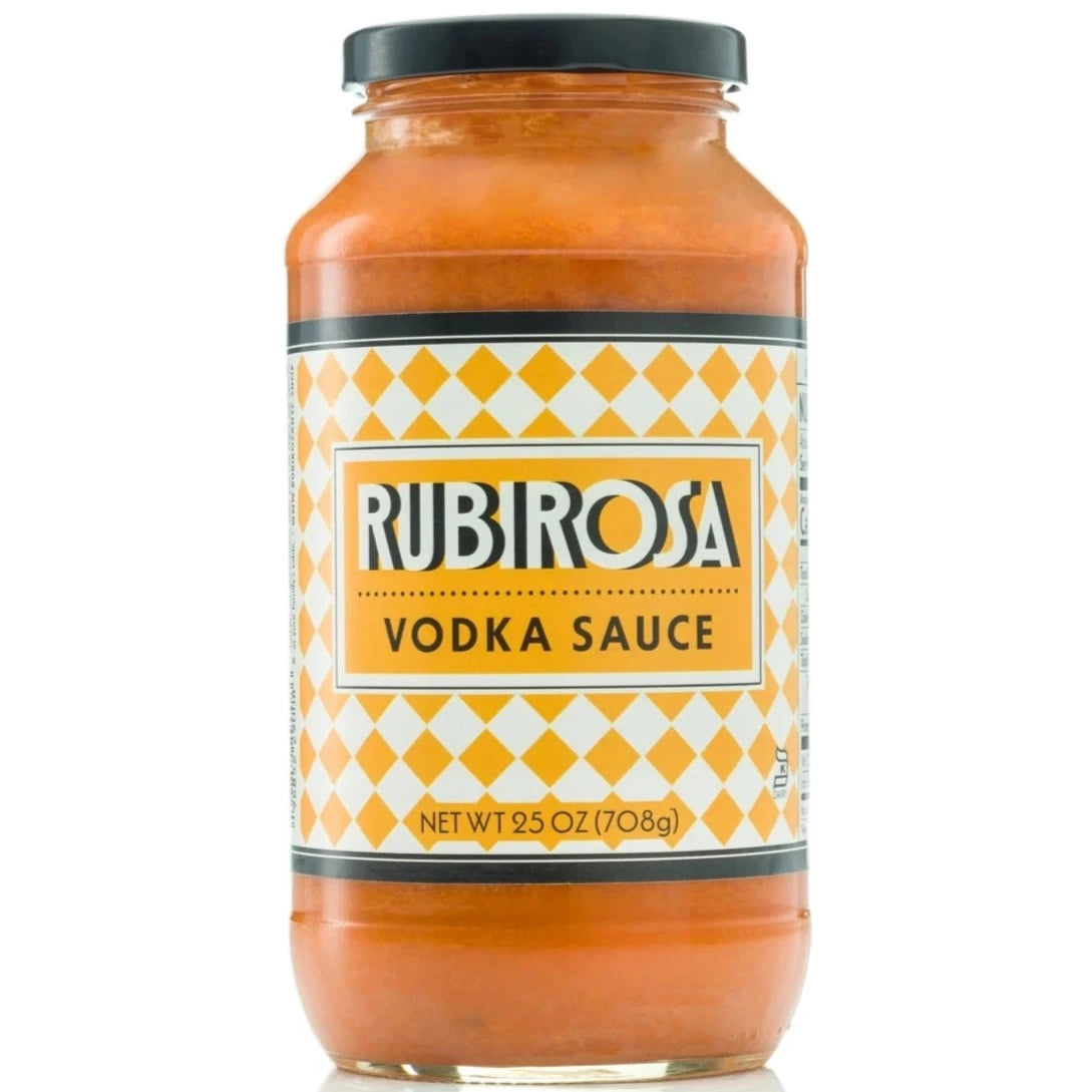 light orange sauce in clear glass bottle with black lid. label is creme and white checkered