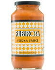 light orange sauce in clear glass bottle with black lid. label is creme and white checkered