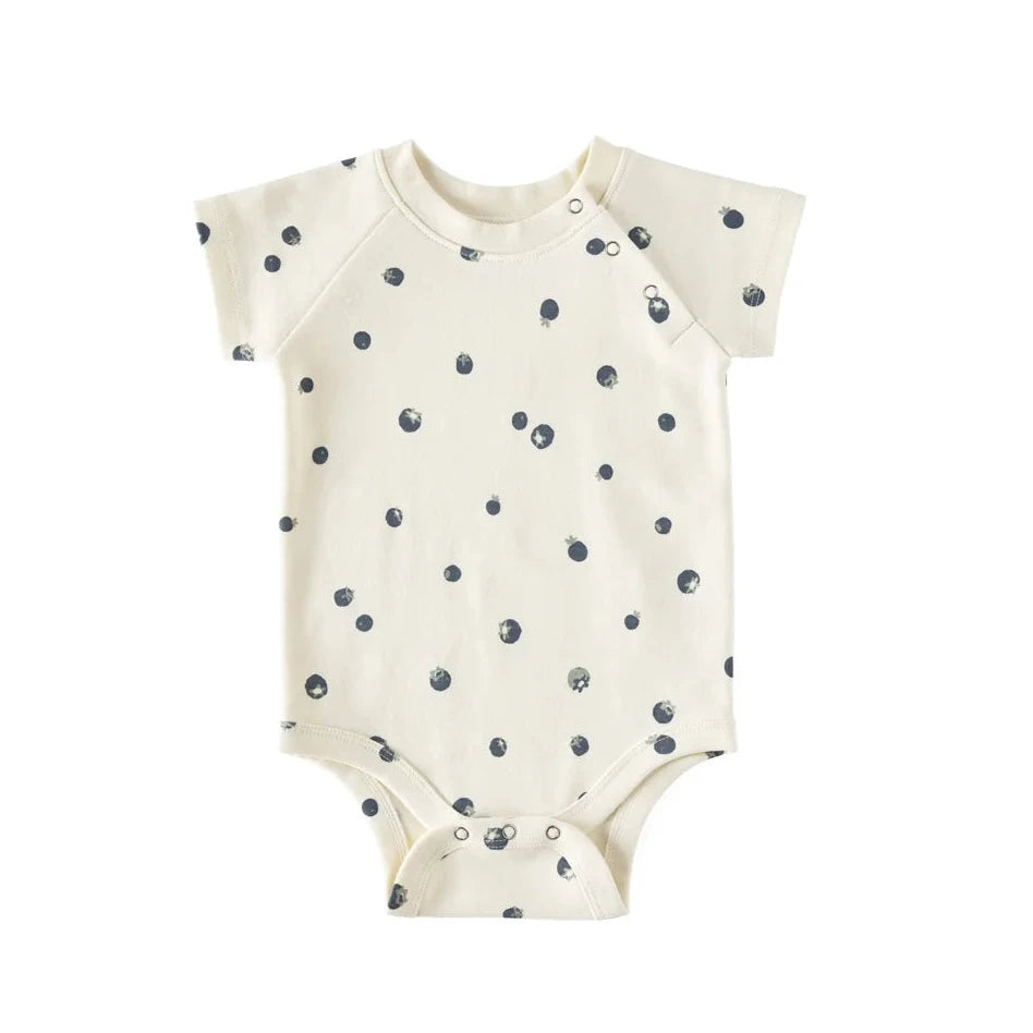 white cotton one piece with blue berries printed on it