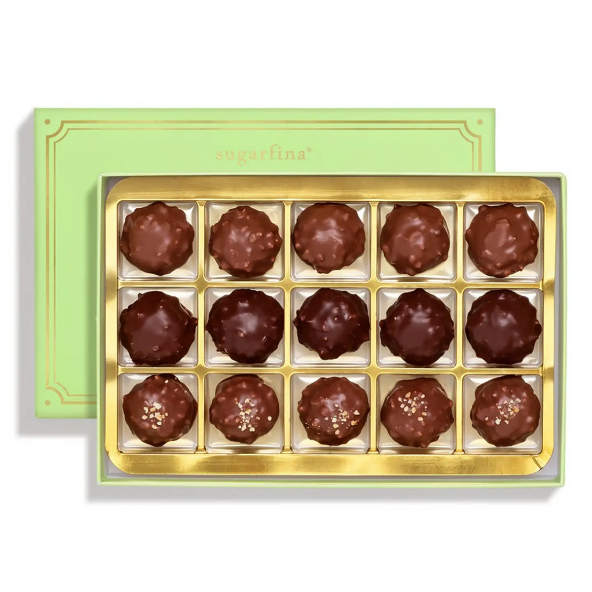 A box of 15 chocolate truffles in a gold tray, with a light green Sugarfina brand box behind it on a white background.