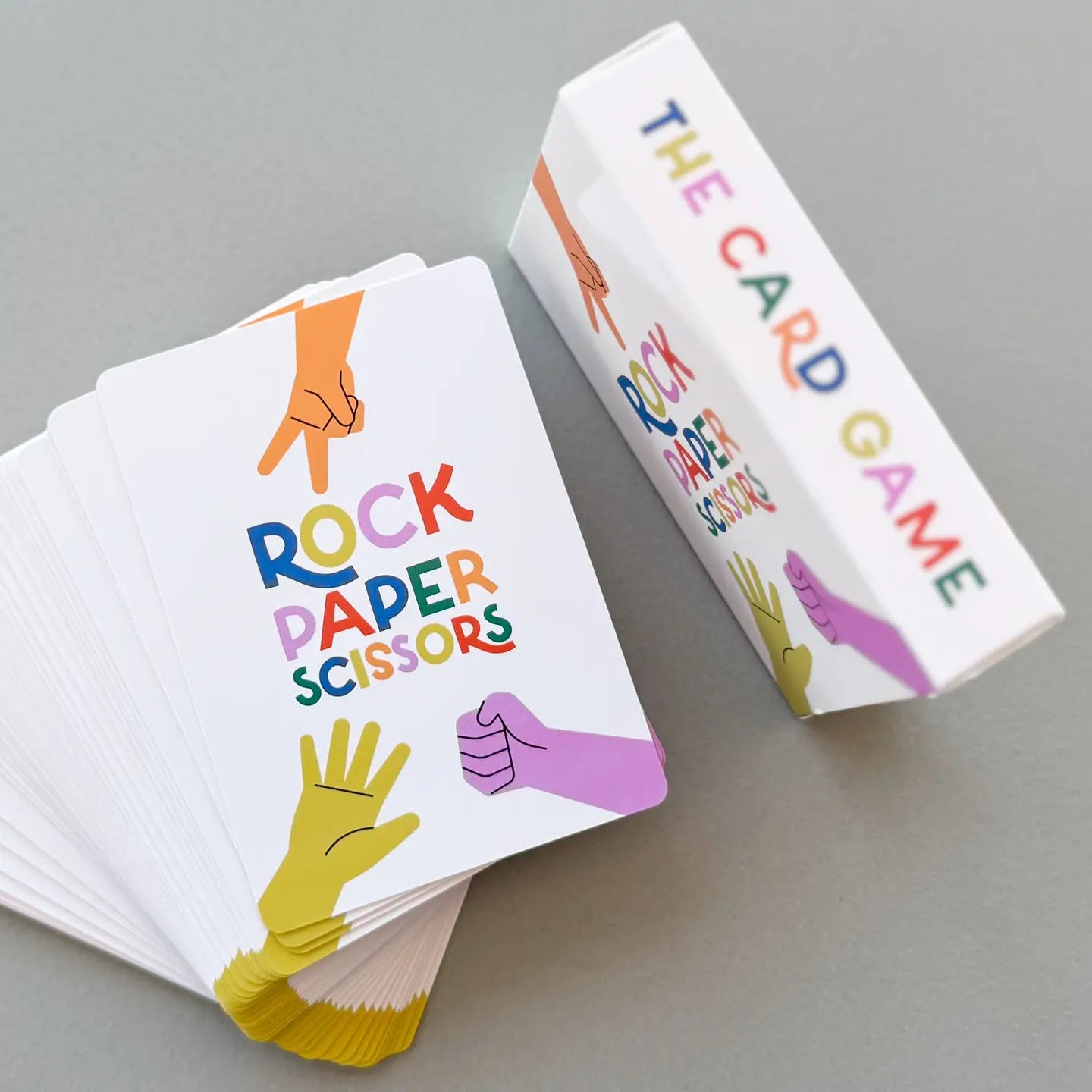 Rock Paper Scissors card game with colorful illustrations on a gray background