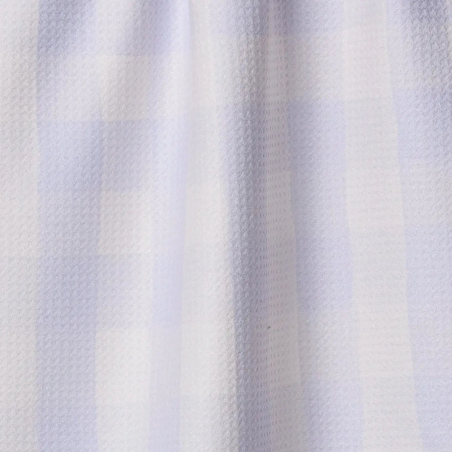 Close-up of a textured fabric with horizontal stripes in light blue and white.
