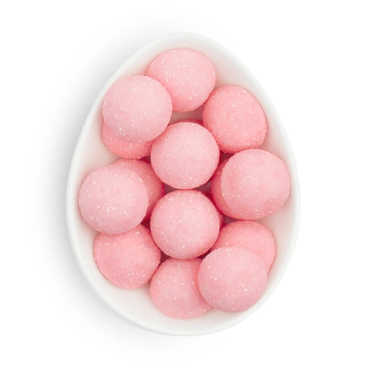 Pink round candies in a white bowl on a white background