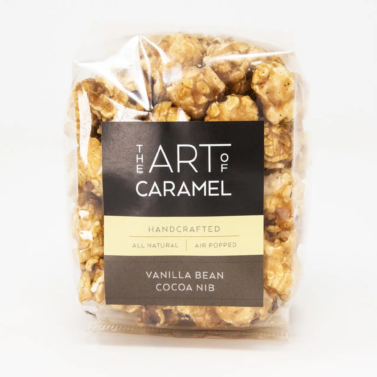 Packaged vanilla bean cocoa nib popcorn with 'The Art of Caramel' label on a white background