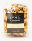 Packaged vanilla bean cocoa nib popcorn with 'The Art of Caramel' label on a white background