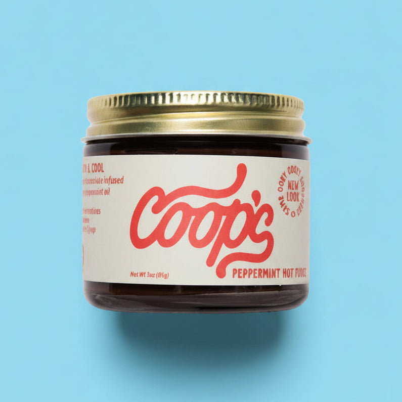 Jar of Coop's product on a white background