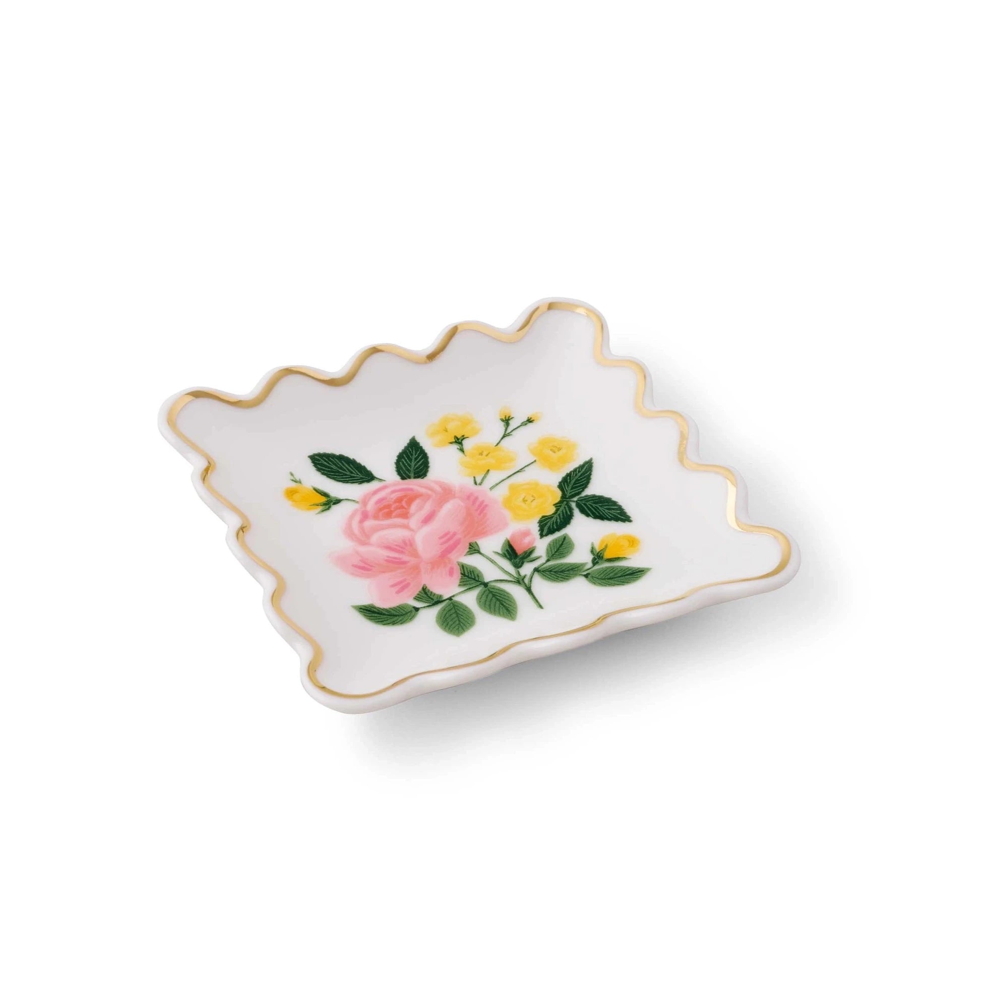 white rectangular ring dish with scalloped edges. in the center is a rose