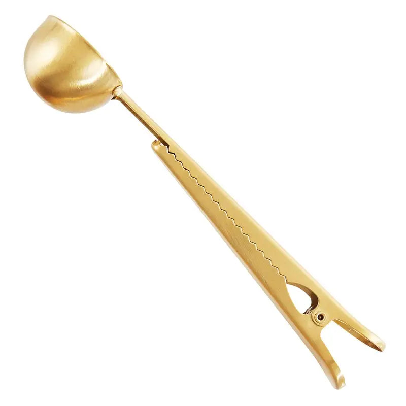 Gold ice cream scoop on a white background