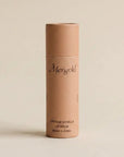 merigold orange lip balm on a beige background