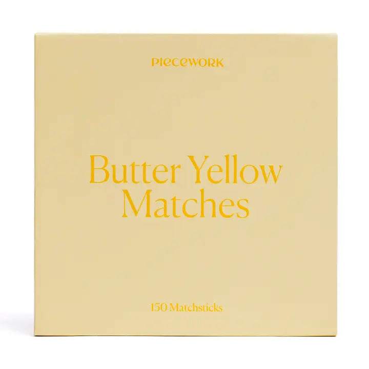 Box of 'Butter Yellow Matches' by PIECEWORK on a beige background