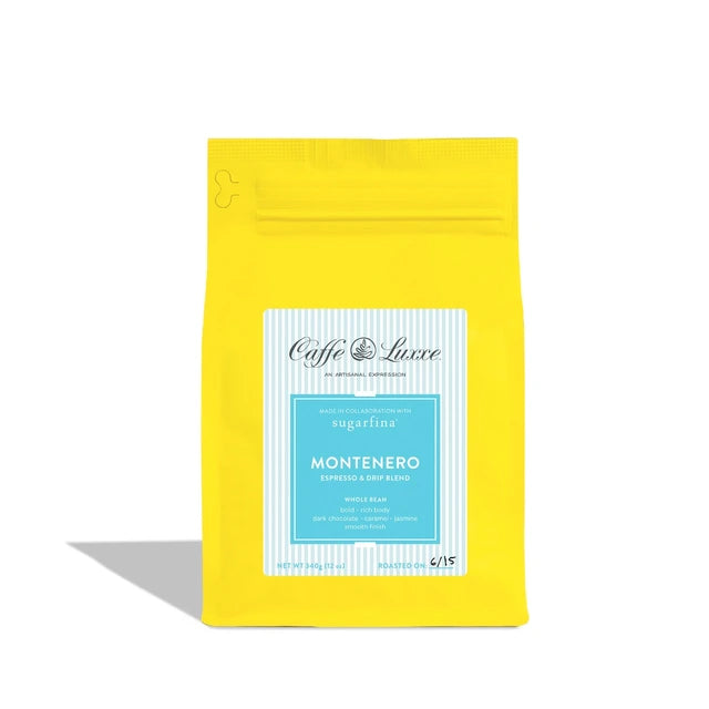 A bright yellow stand-up pouch of Caffe Luxe Montenero espresso bean roast, featuring a white and light blue label on the front, set against a plain white background with a soft shadow.