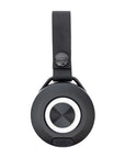 Black circular device with strap on a white background