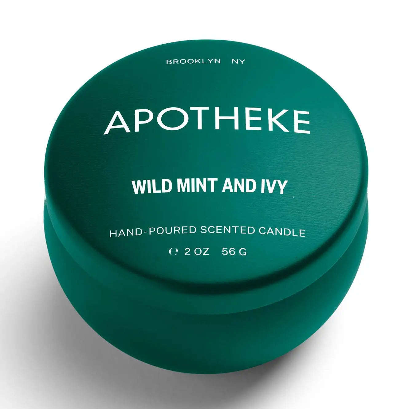 Green container of Apotheke Wild Mint and Ivy scented candle on a white background