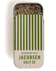 beige and green stripped salt tin slid down with salt and rosemary in it