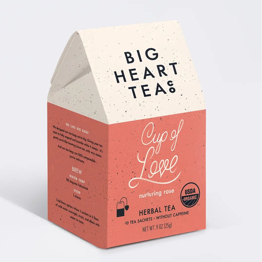 Big Heart Teas Cup of Love herbal tea packaging on a light gray background