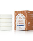 Set of white shower steamers with a brown and white packaging box on a white background