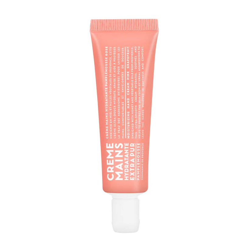 Pink hand cream tube on a white background