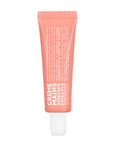 Pink hand cream tube on a white background