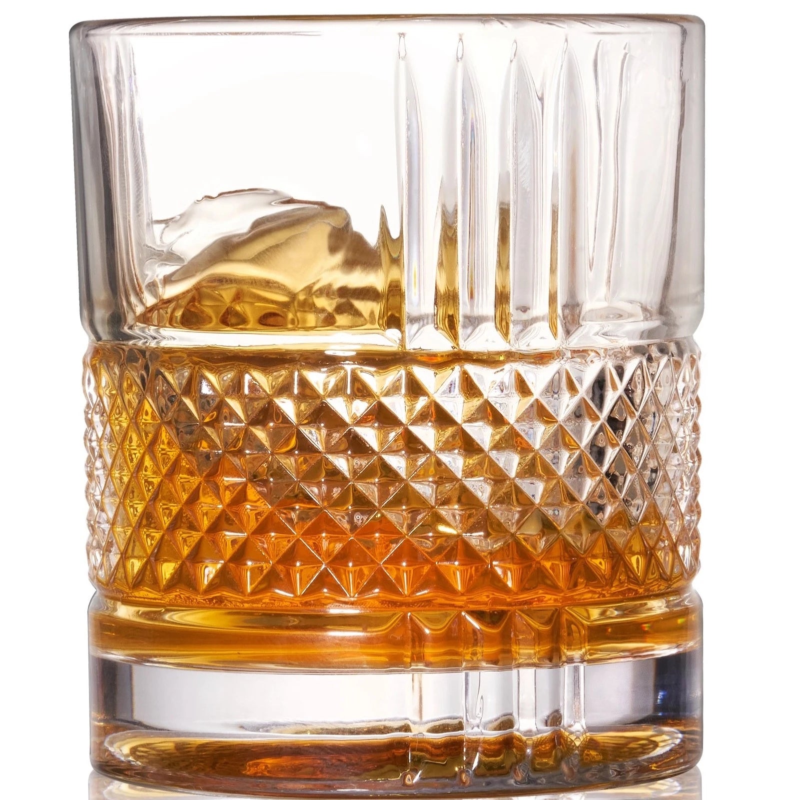 crystal whiskey glass with whiskey in it