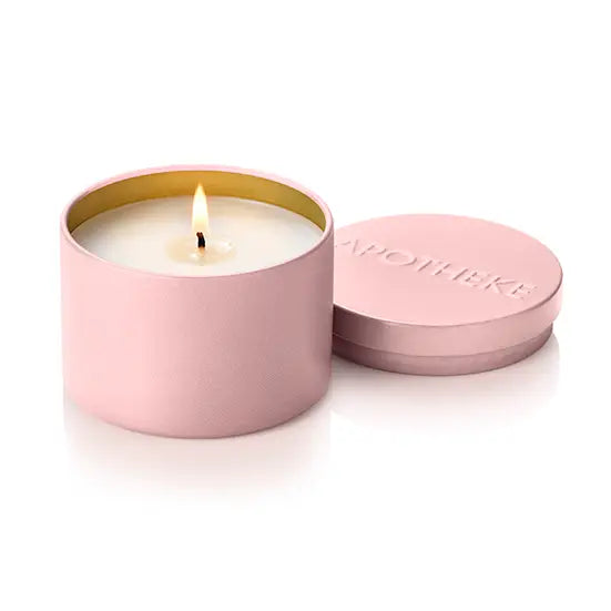 A pink metal candle tin with a lit wick and white wax, shown next to its matching pink lid on a clean white background. The lid features the brand name 'MAYIHEKE' embossed on top.