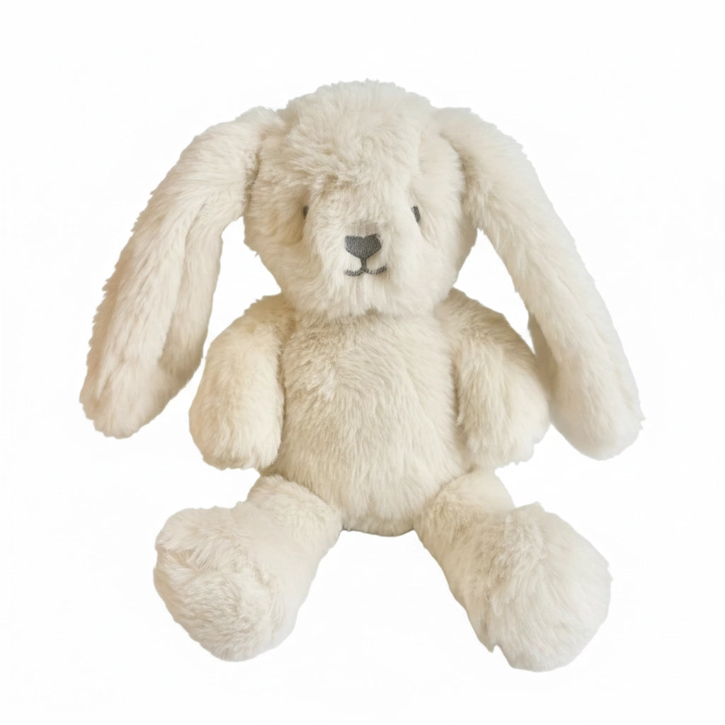 Beige plush bunny toy on a white background