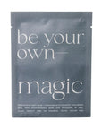 A single-use skincare packet for a Korean face sheet mask. The packaging is a dark slate gray with white text reading 'be your own-magic' and smaller text detailing the hydrating ingredients and product features.
