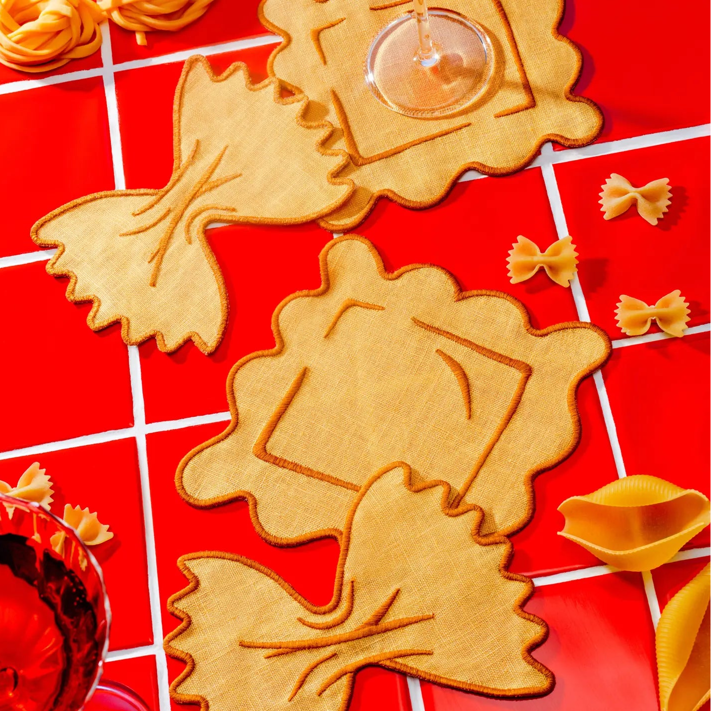 pasta shaped napkins with a red background