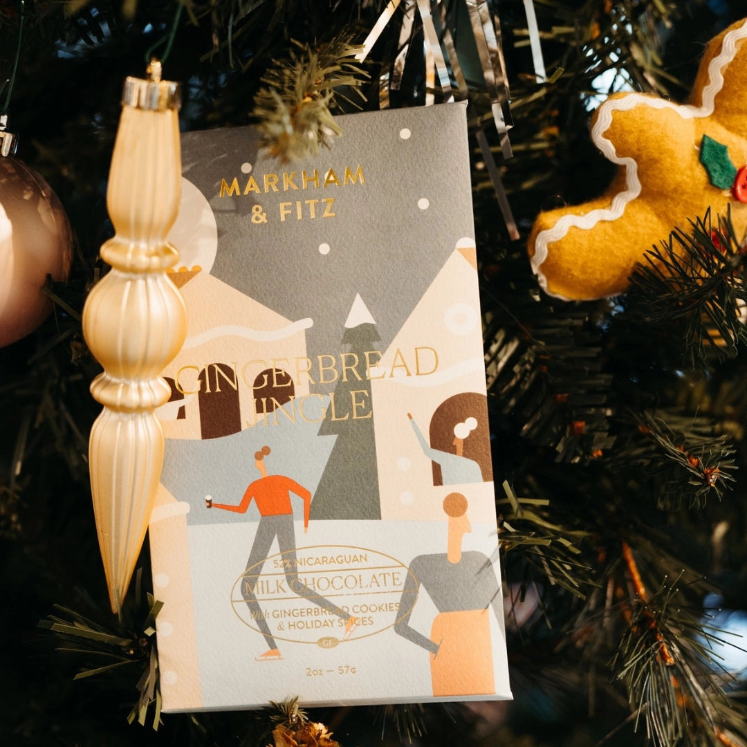 Chocolate bar packaging with 'Markham & Fitz' on a Christmas tree with gingerbread man ornament.