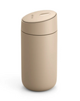 Beige trash can on a white background