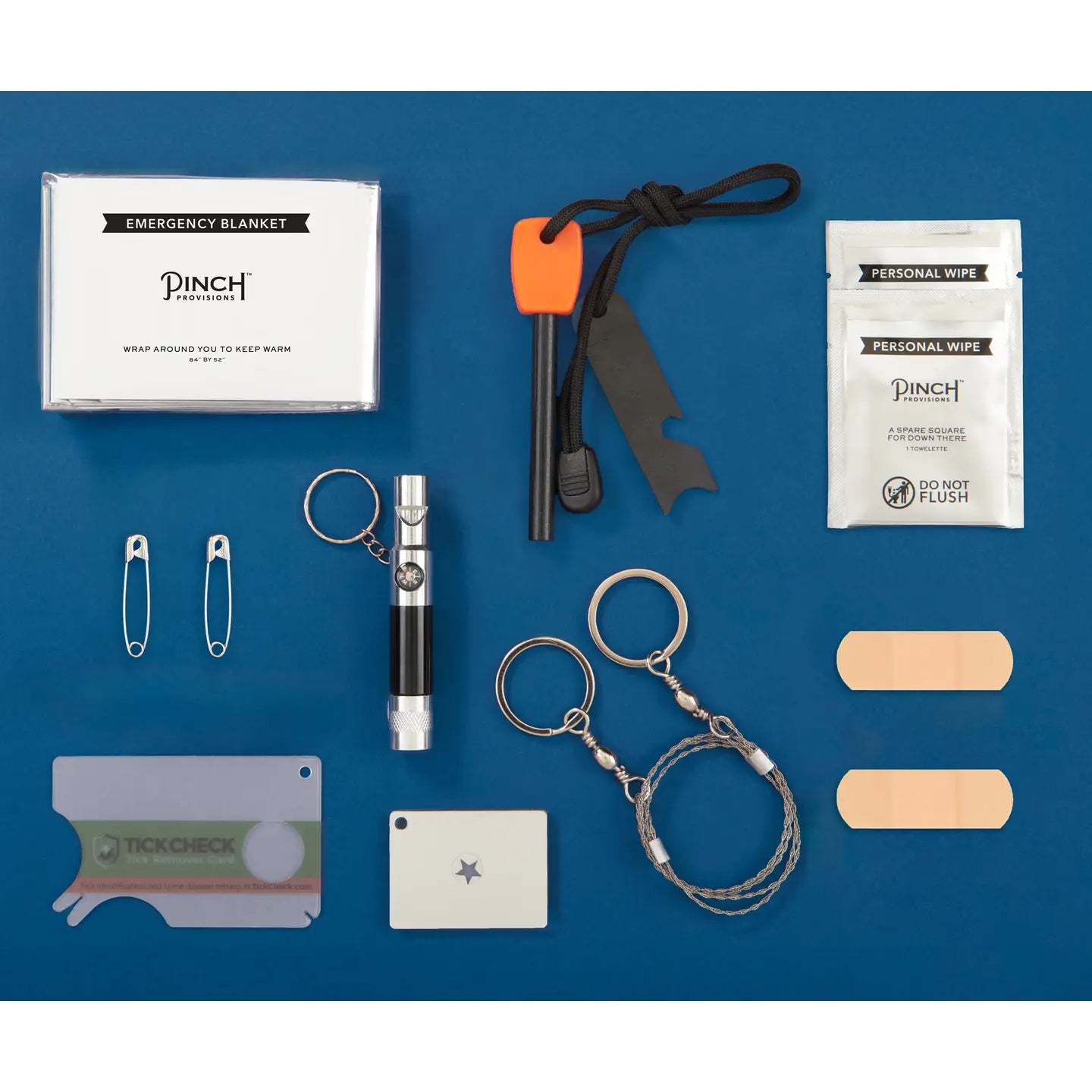 Collection of emergency survival items including a fire starter, personal wipes, and band-aids on a blue background.