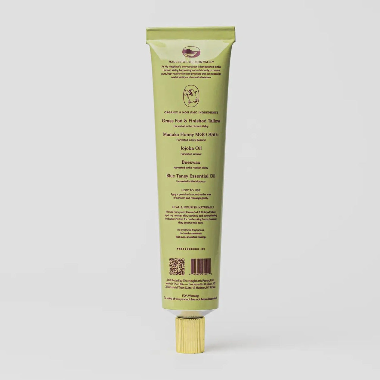 A single tube of green and finished salmon hand cream by Dr. Japara, shown from the back against a light gray background.