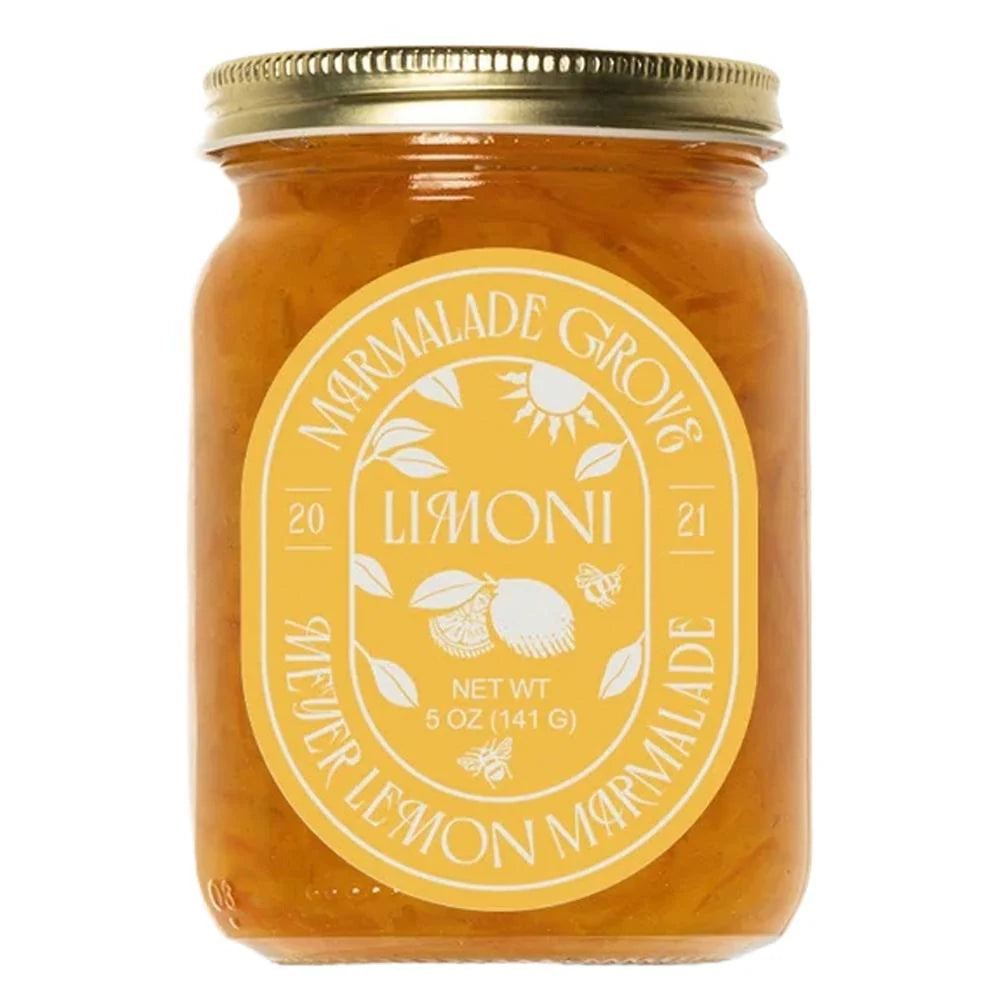 Jar of limoncello with a gold lid on a white background