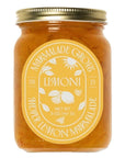 Jar of limoncello with a gold lid on a white background