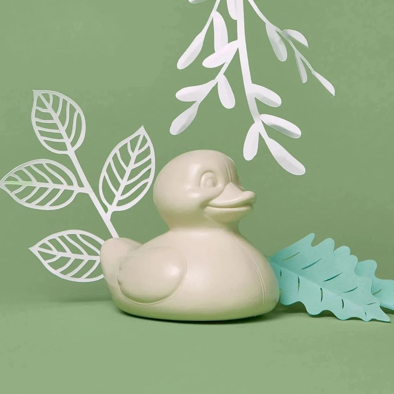 creme duck with green background