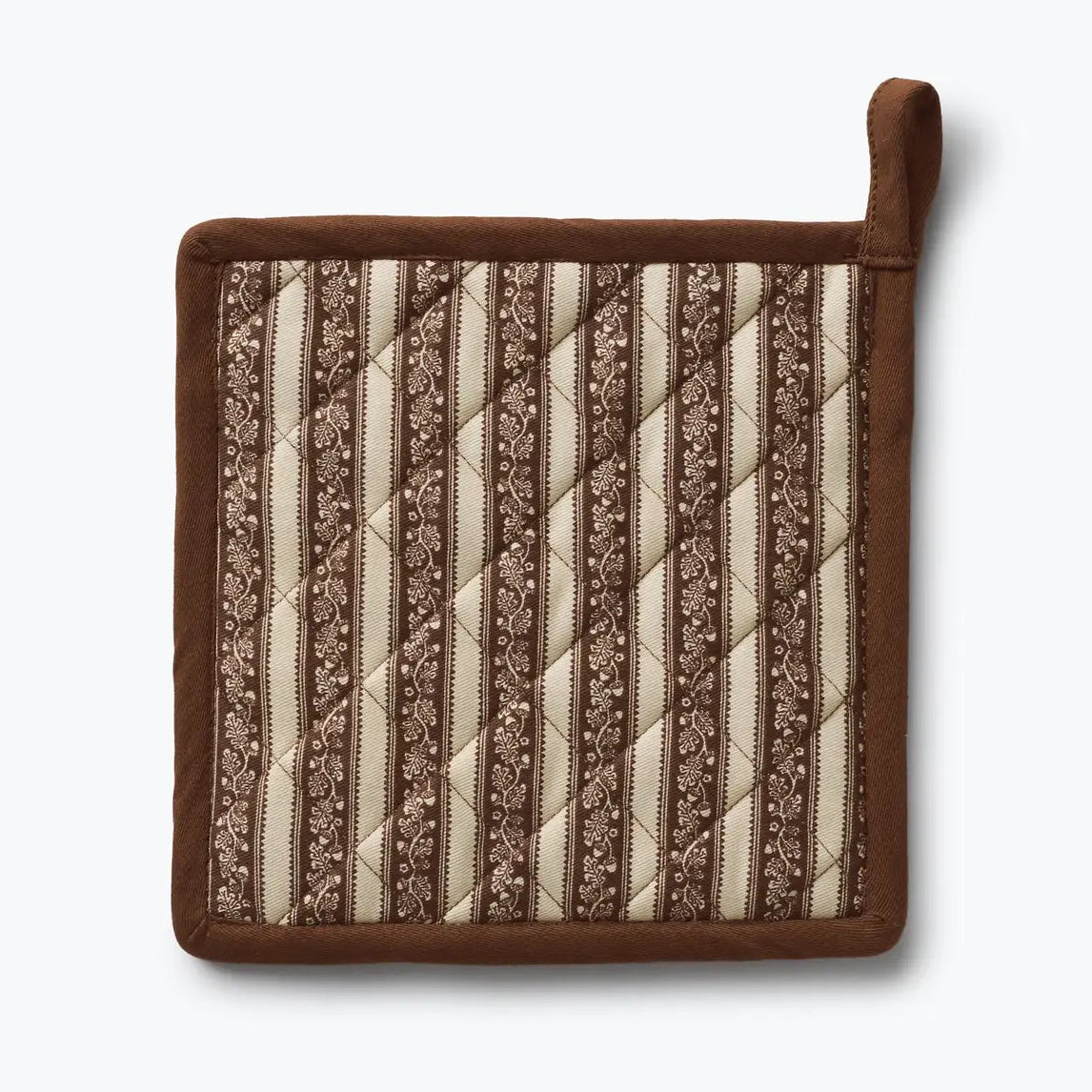 A square quilted pot holder with a brown suede-like border and handle, featuring vertical striped patterns in cream and brown on the front, shown against a light gray background.
