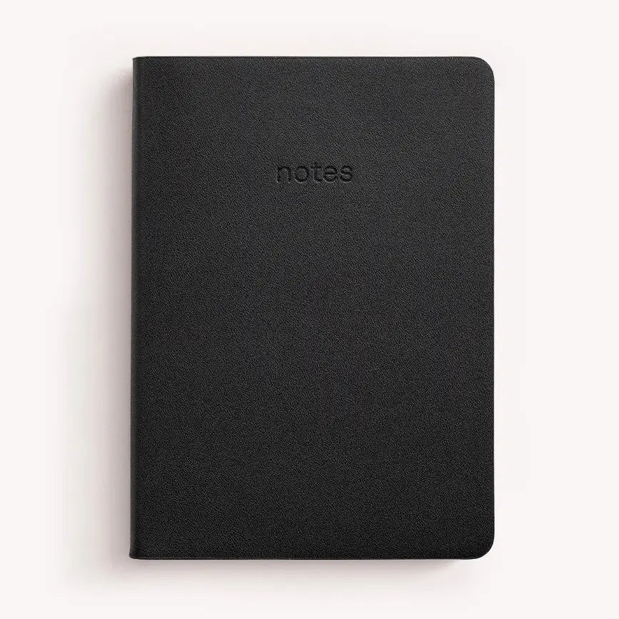 Black notebook with 'notes' embossed on the cover against a white background