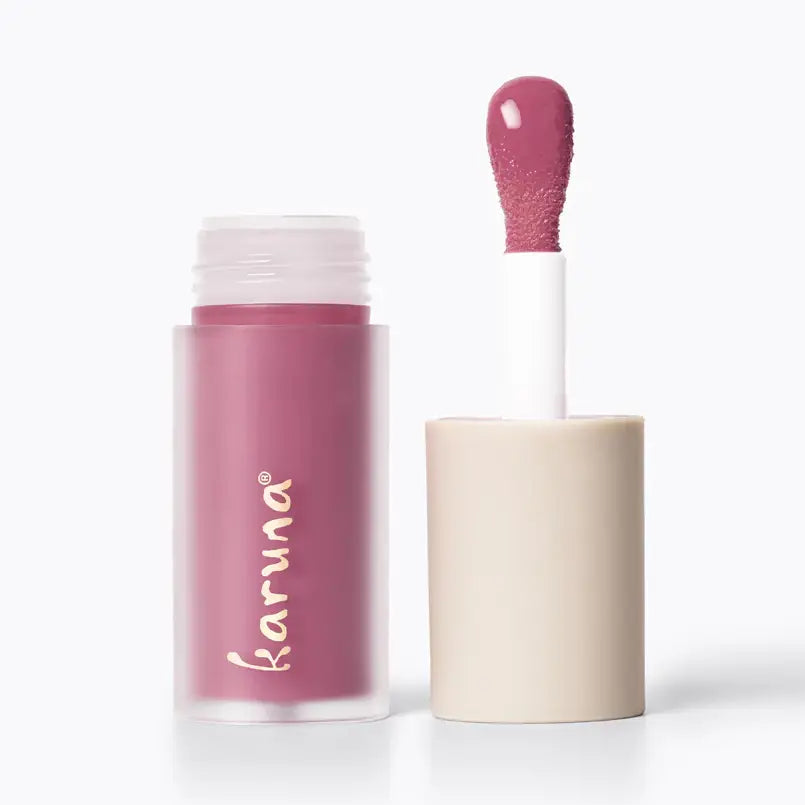 Lip tint with applicator and visible brand name on a white background