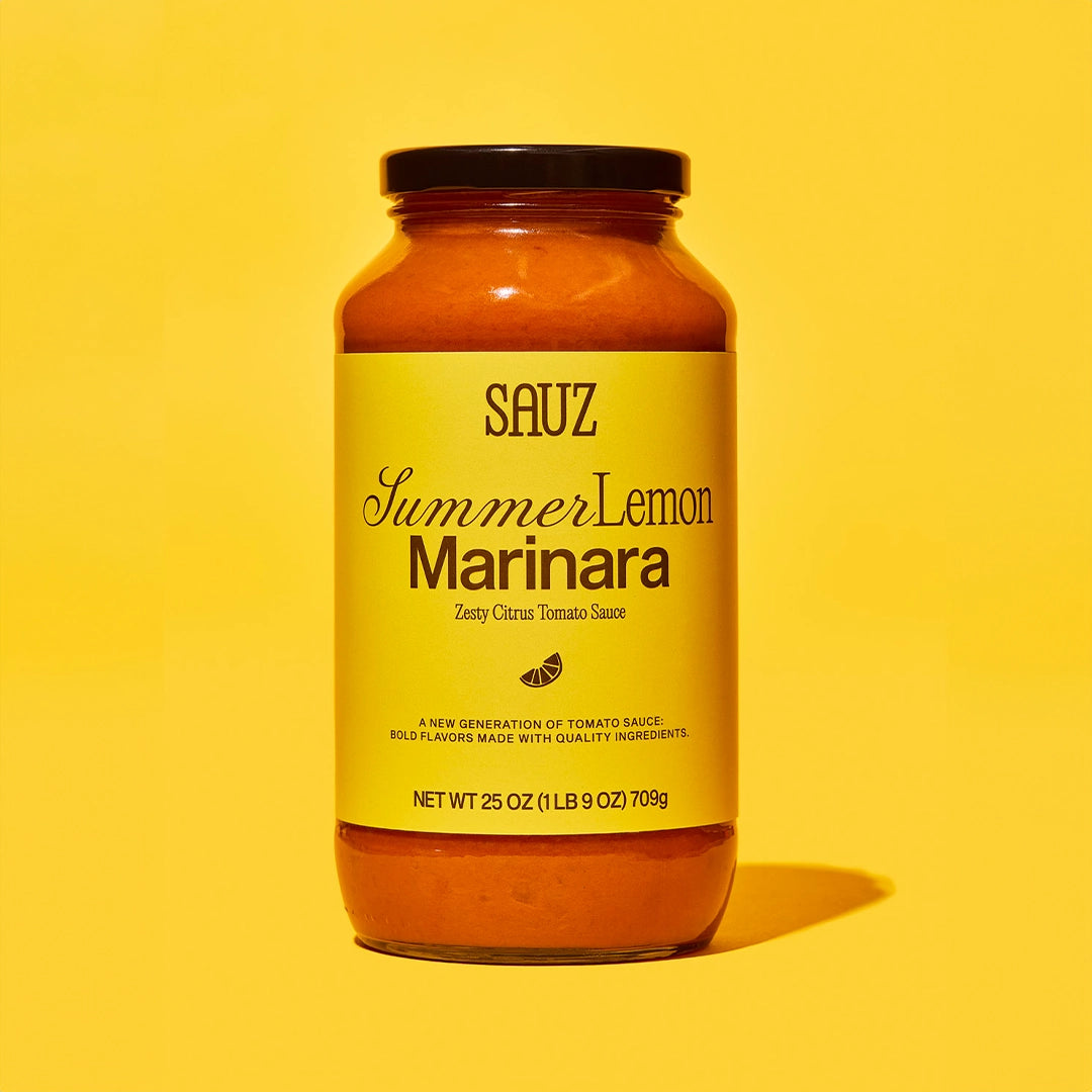 Jar of Sauz Summer Lemon Marinara sauce on a yellow background